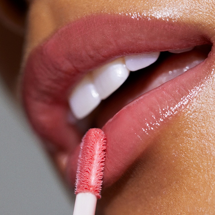 Close up of Long-Wear Cream Shadow Stick with swatch behind on top of a soft-grey background